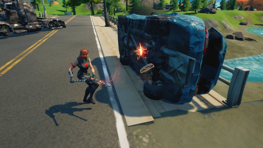 pièces d'artisanat fortnite Le joueur pirate une voiture retournée pour récolter des pièces mécaniques à fabriquer dans Fortnite. Un camion qui a explosé est proche.